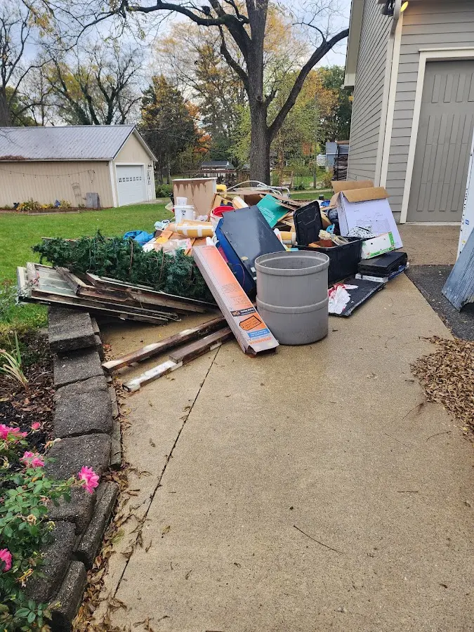 Dumpster being loaded with debris for Commercial Dumpster Rental in Springfield